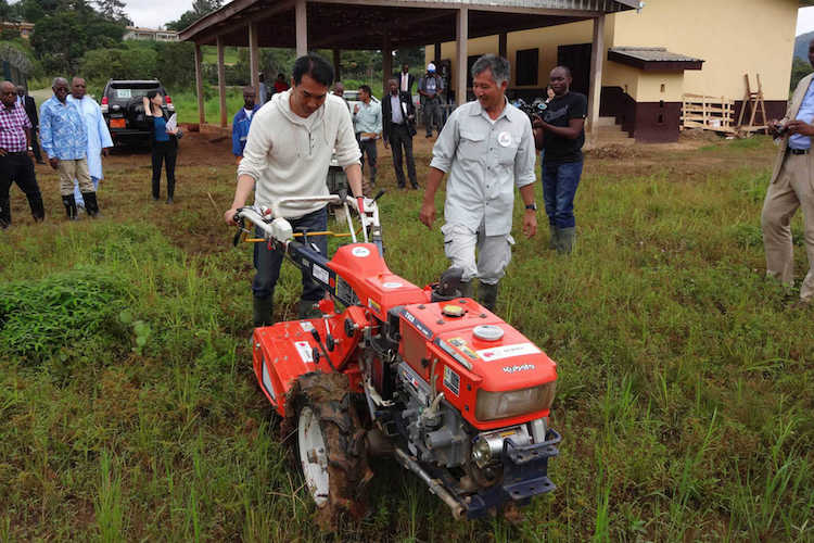 Photo: Japan’s senior vice-minister of agriculture, forestry and fisheries Taku Eto tries out a Japanese-made tilling machine in Cameroon. Credit: The Government of Japan 